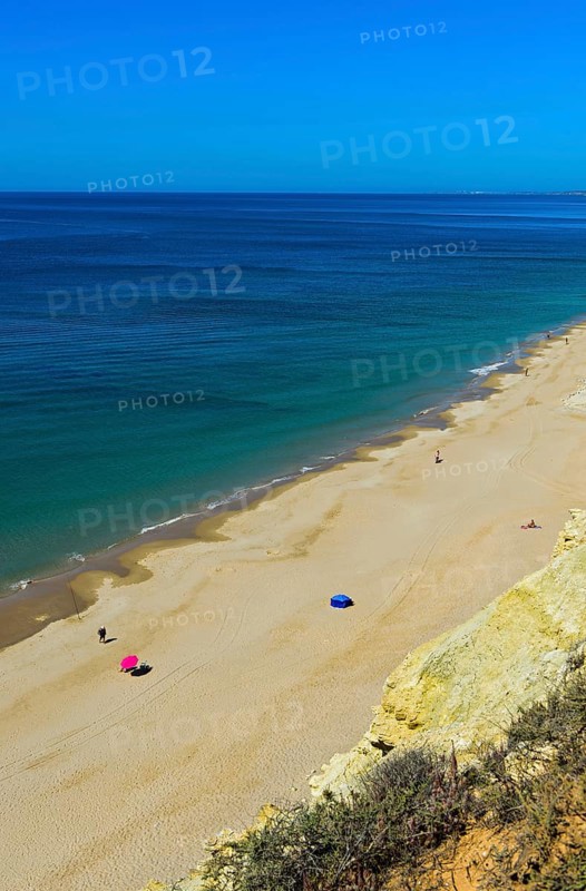 Long empty sandy beach in the Algarve