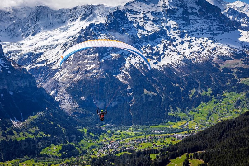 Paraglider after take off from First mountain above Grindelwald