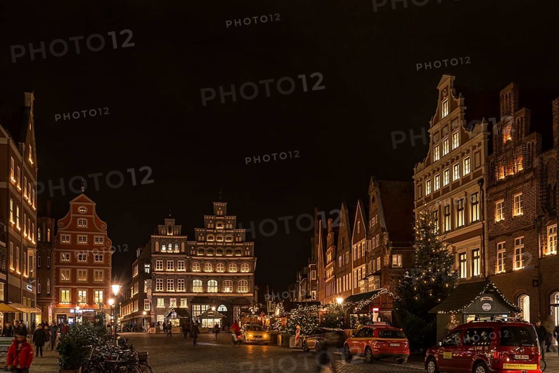 Old gabled houses in Christmas lighting in the evening