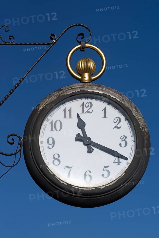 Hanging shop sign as pocket watch at a watch shop