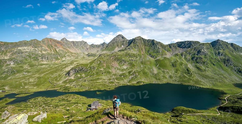 Hiker on the way to the mountain hut Ignaz-Mattis-Hutte