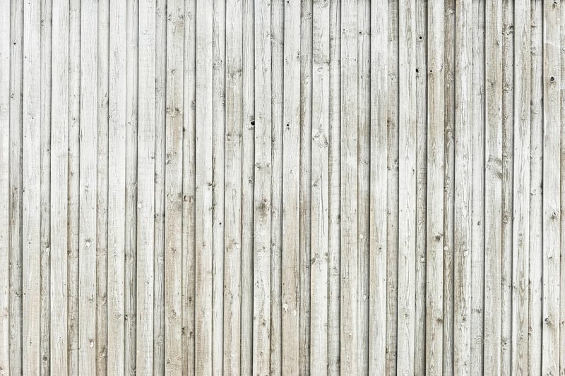 Wooden wall made of horizontally arranged unpainted boards