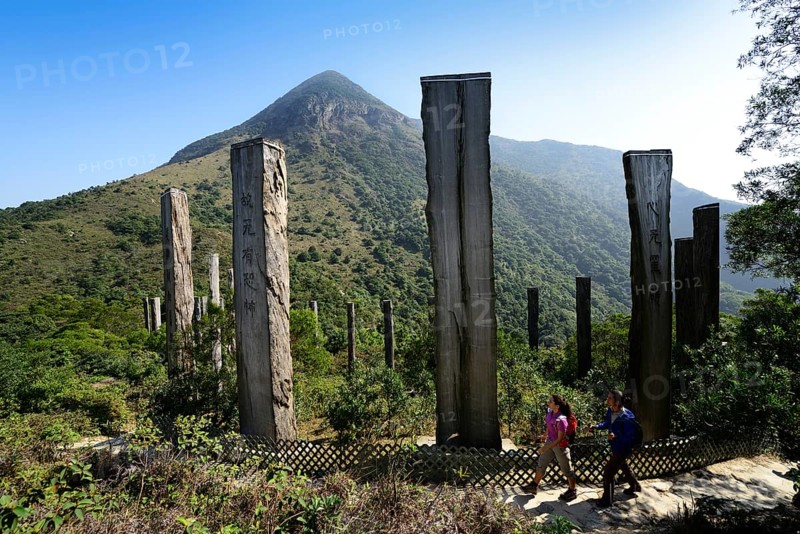 Hikers in front of wooden stelae at Wisdom Path