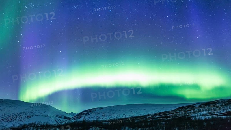 Northern Lights (Aurora borealis) over mountains