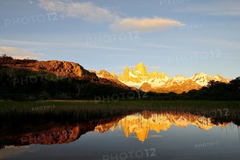 Mountain range with Cerro Fitz Roy at sunrise reflected in Lago de Los Tres