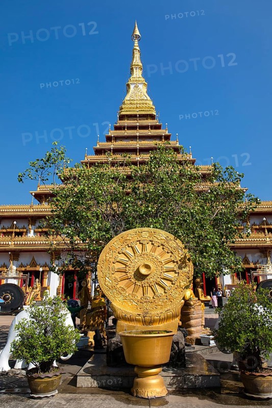 Wheel of Life in front of a nine-story Stupa Phra Mahathat Kaen Kakhon