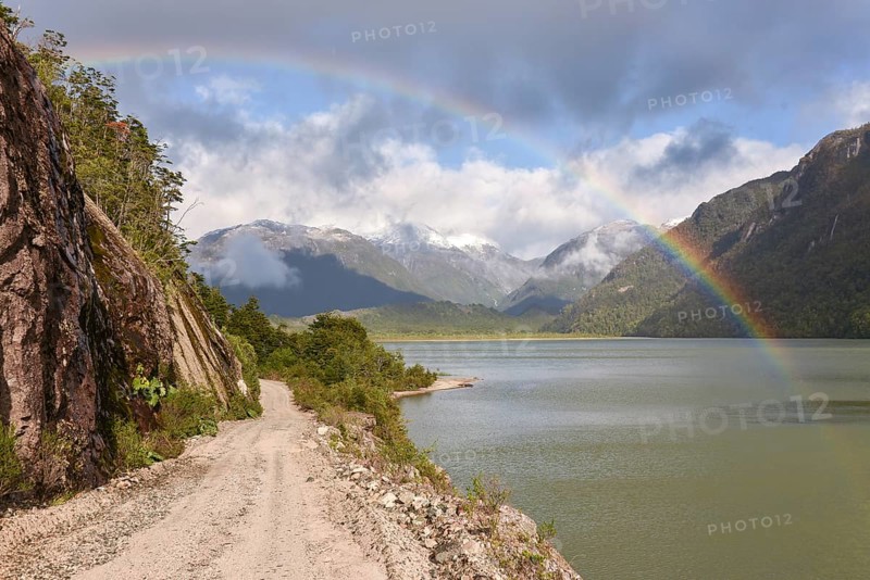 Gravel road with rainbow at Puerto Rio Tranquilo