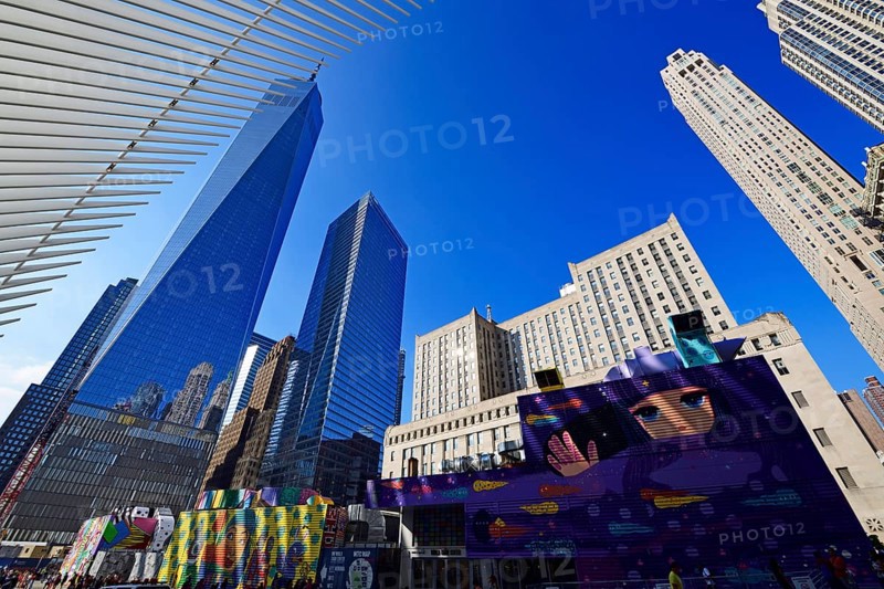 Construction site with graffiti decorated walls in front of the Oculus