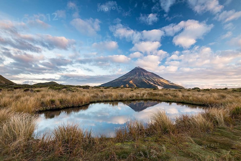 Stratovolcano Mount Taranaki or Mount Egmont reflected in Pouakai Tarn