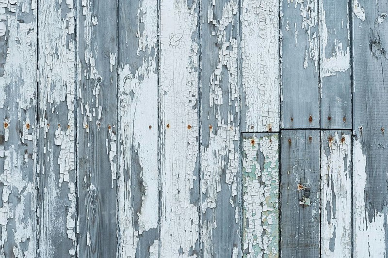 White peeling paint on wooden wall