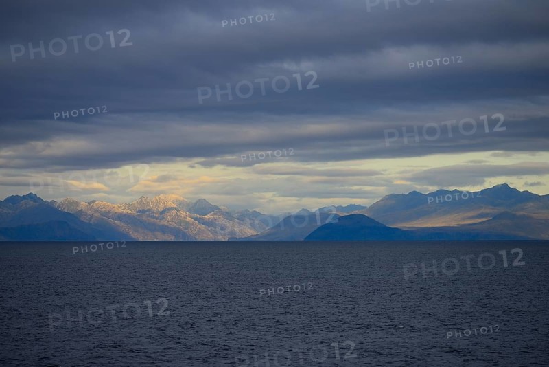 Coastal landscape with dark clouds