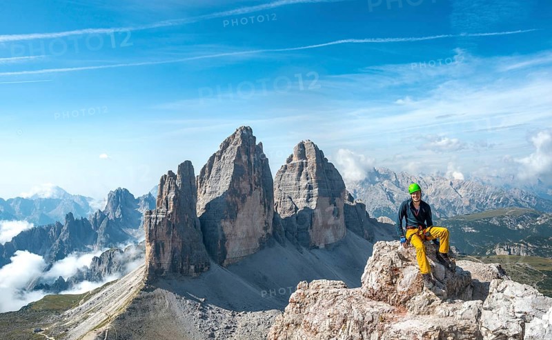 Hiker at the summit of the Paternkofel