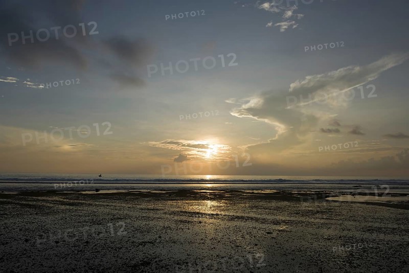 Littoral zone at low tide at sunset