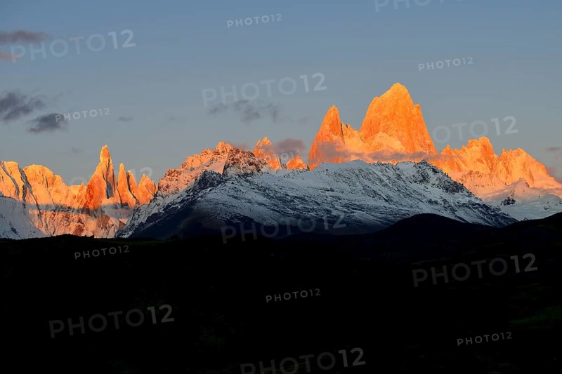 Snow-covered mountain range of the Fitz Roy and Cerro Torre at sunrise