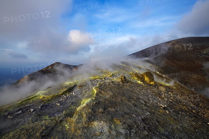 Sulfur fumaroles and chloride crusts on the crater rim