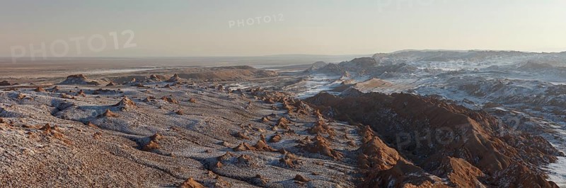 Bizarre red rock formations with white salt