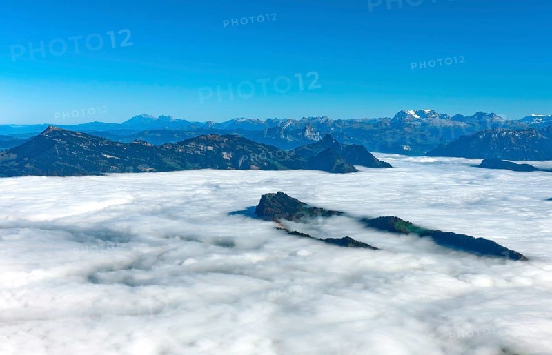 The Burgenstock rises from the sea of fog over Lake Lucerne