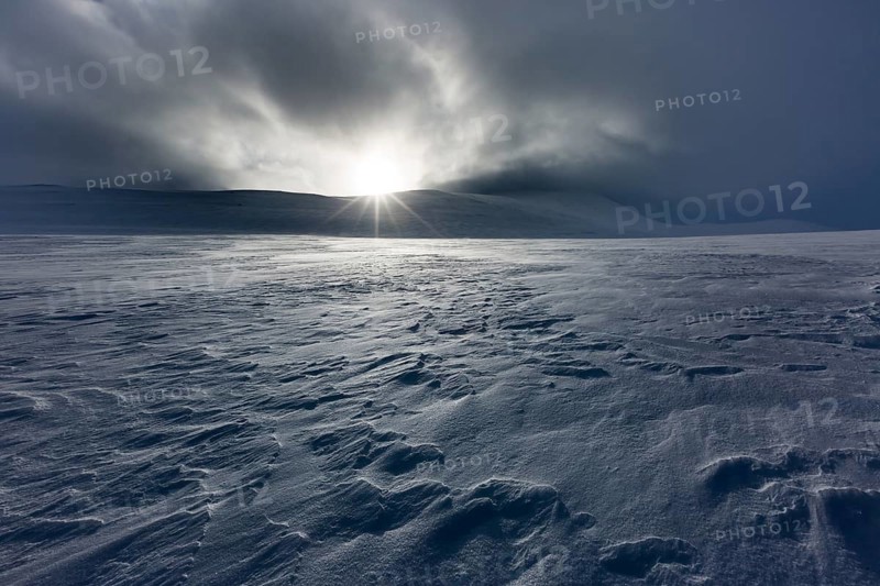 Sun with clouds and snow