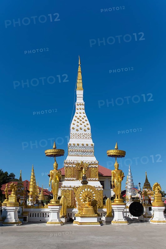 Chedi of Wat Mahathat Temple with Wheel of Life and golden Buddha figures
