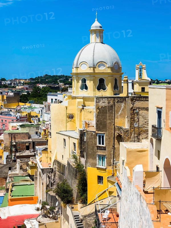 View of the island of Procida with its colourful houses and the church of Santuario S. Maria delle Grazie Incoronata