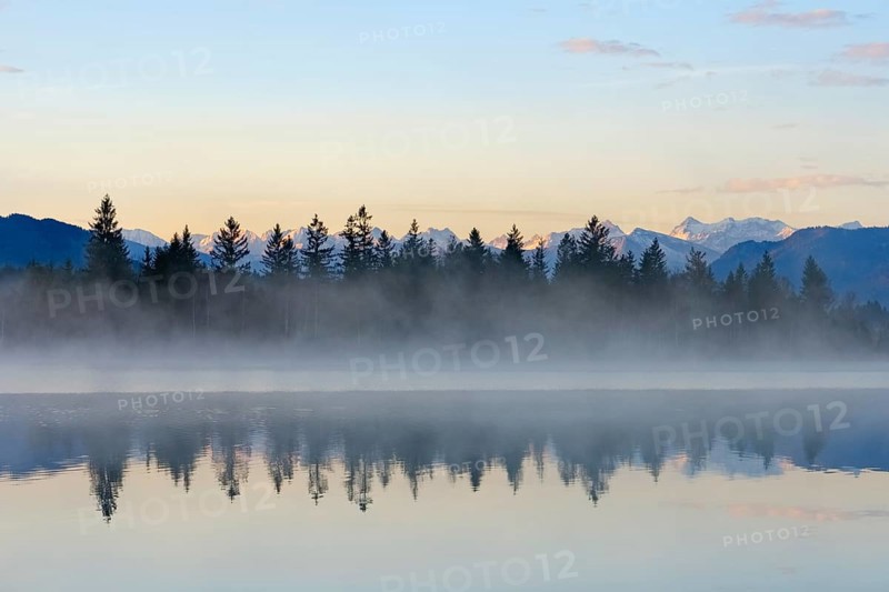 Morning atmosphere with early morning mist at Kirchsee