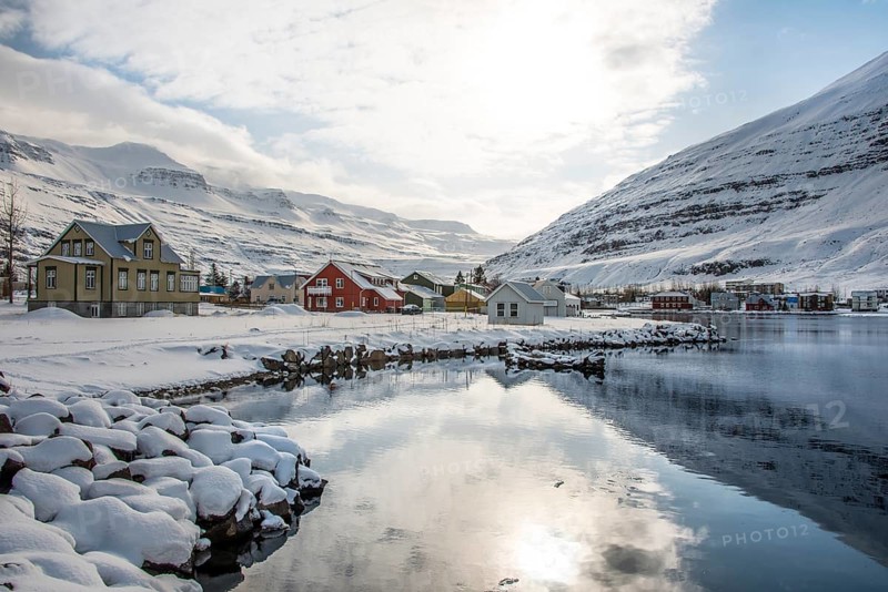 View over the village Seyoisfjorour with snow