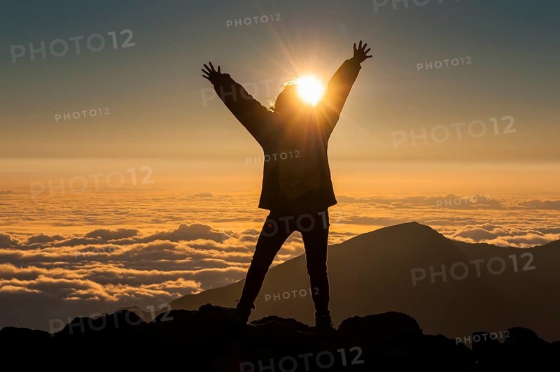 Tourist in backlight waiting for sunset on top of Haleakala National Park