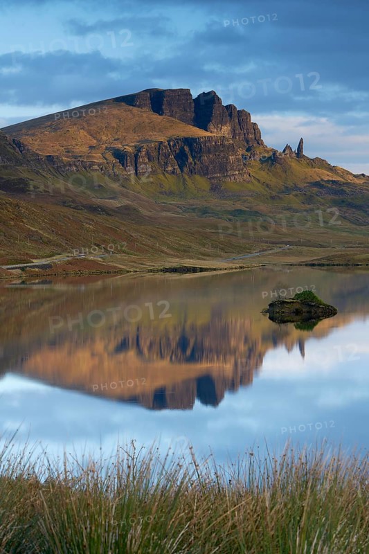 Rock formation of the Old Man of Storr with Loch Leathan