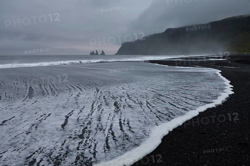 Expiring surf on the black beach near Vik i Myrdal