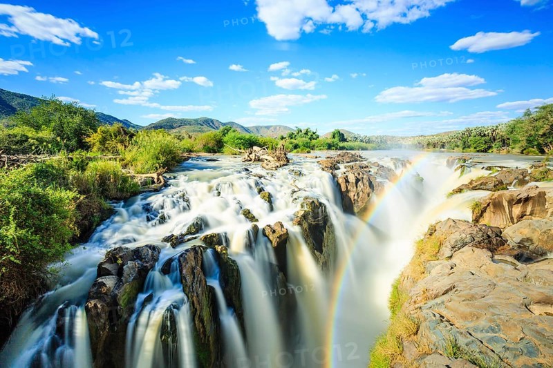 Rainbow over waterfall