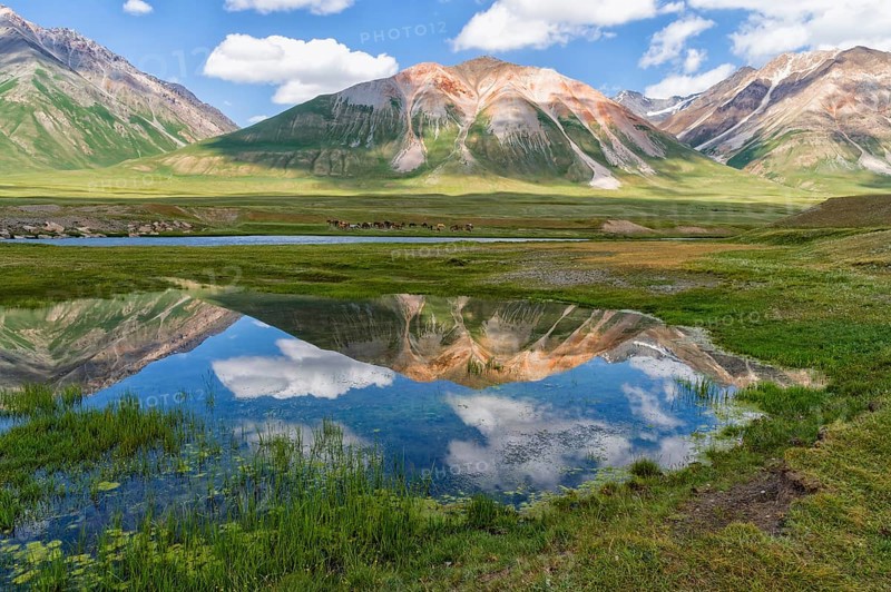 Mountains reflecting in water