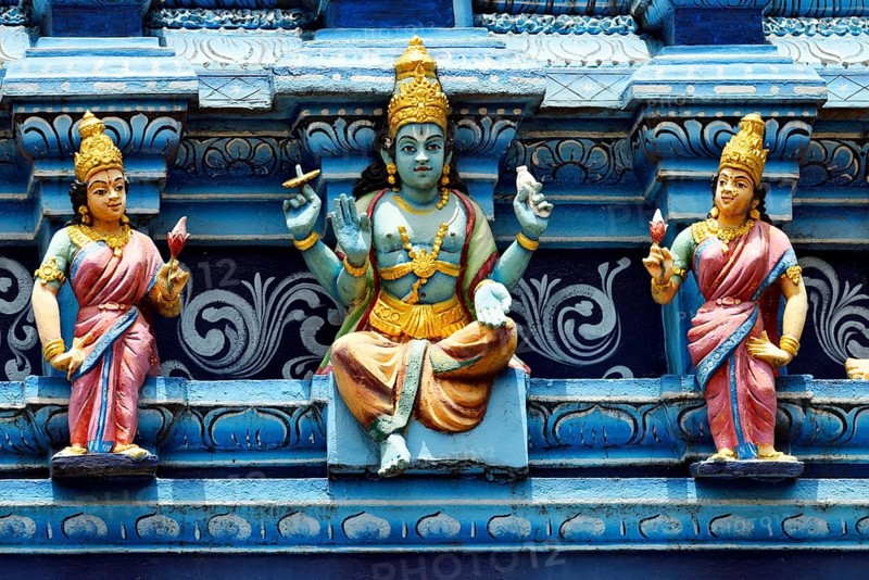 Colorful Hindu temple decorated with figures and gods