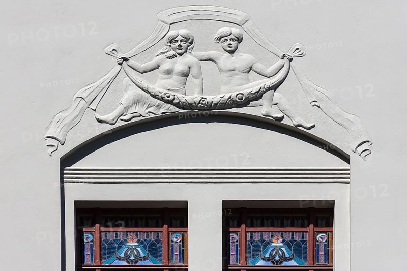 Relief and stained-glass windows on a town house