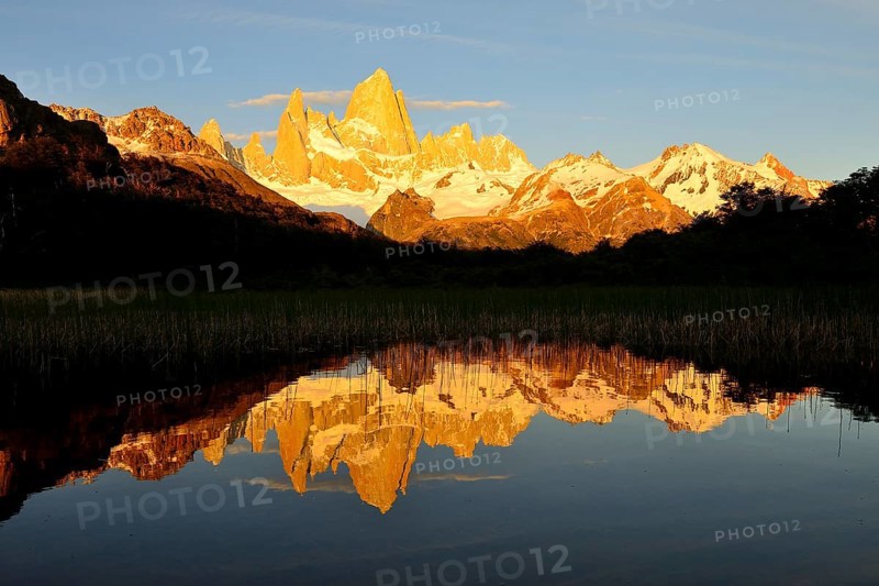 Mountain range with Cerro Fitz Roy at sunrise reflected in Lago de Los Tres