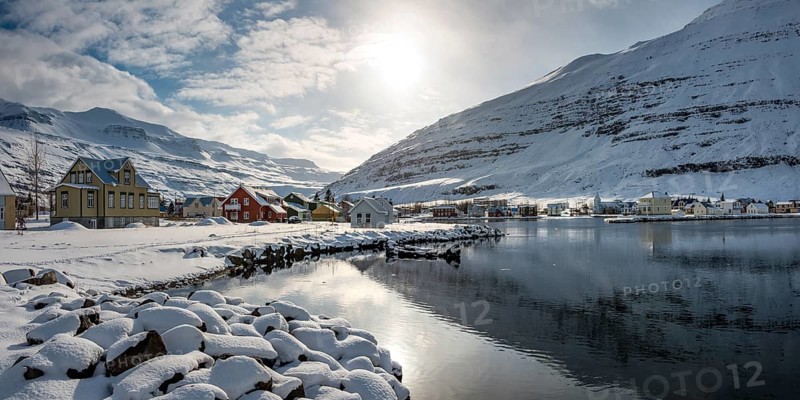 View over the village Seyoisfjorour with snow