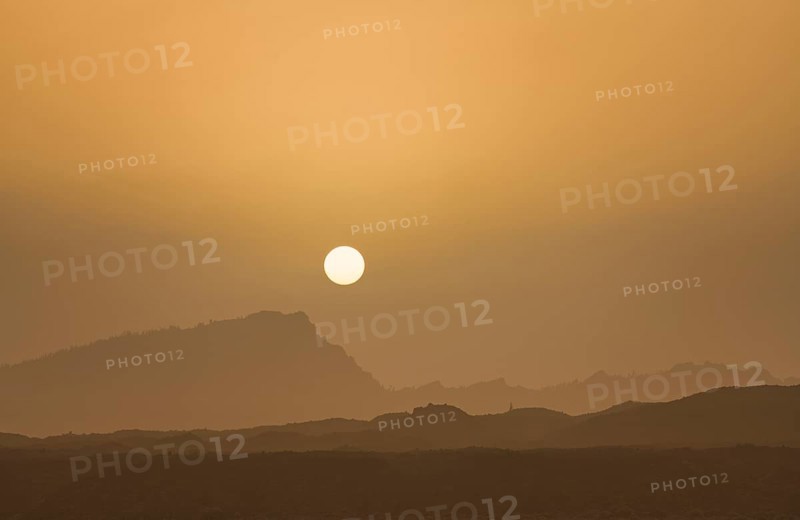 Sunset with mountain silhouette
