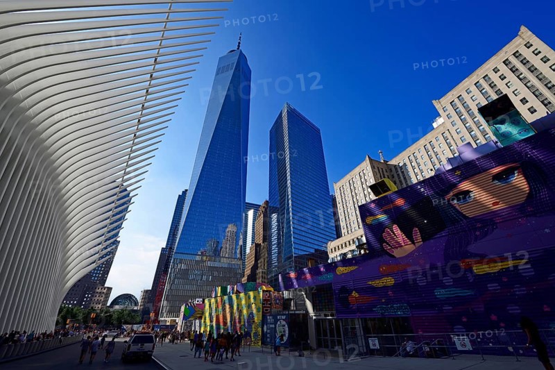 Construction site with graffiti decorated walls in front of the Oculus