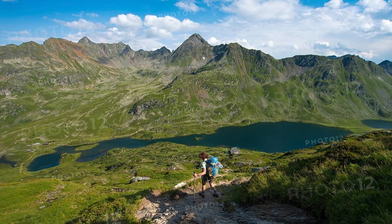 Hiker on the way to the mountain hut Ignaz-Mattis-Hutte