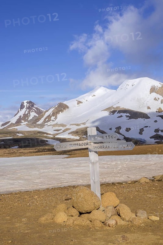 Signposts behind mountain Loomundur Fannborg and Snaekollur