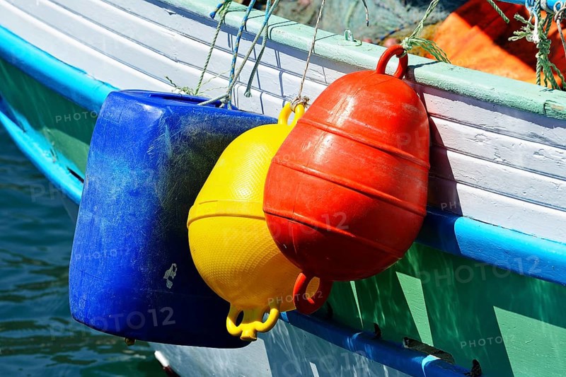 Fishing boat with colourful buoys