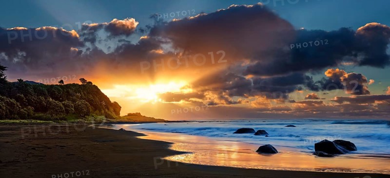 Sunset on the beach of Oakura