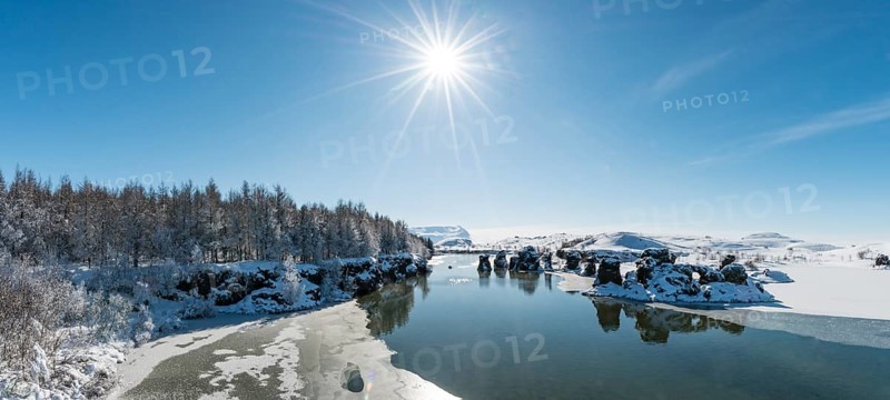 View of volcanic rock formation in the water