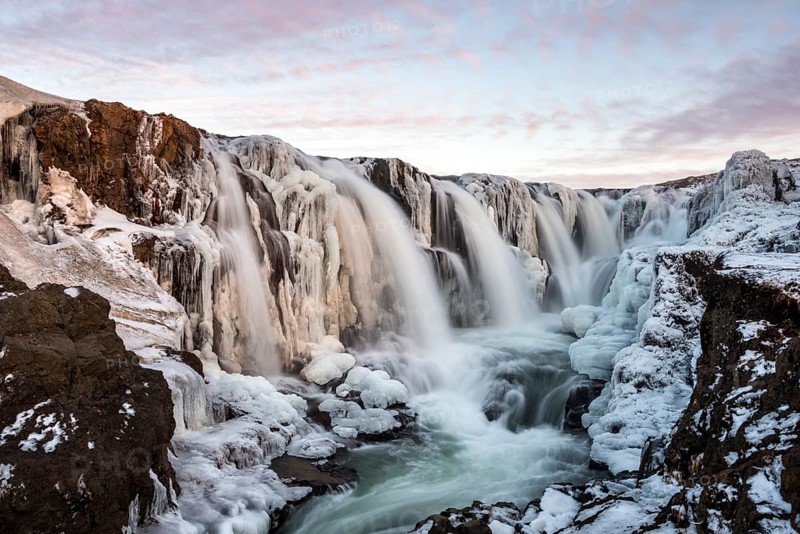 Waterfall with ice and snow in winter