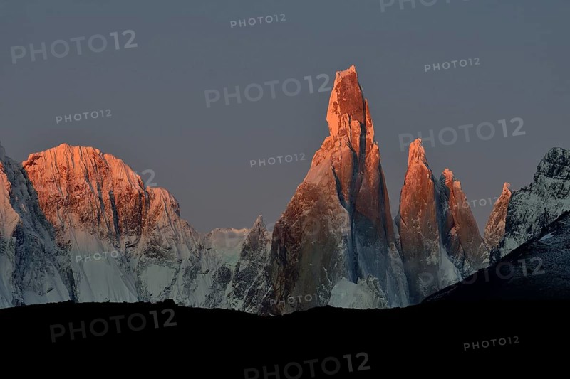 Snow-covered massif of Cerro Torre at sunrise