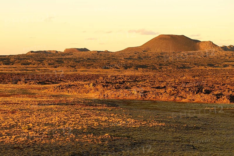 Volcanic landscape with volcanic cones in the evening sun