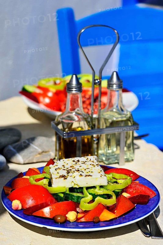 Greek salad with sheep cheese served on plate
