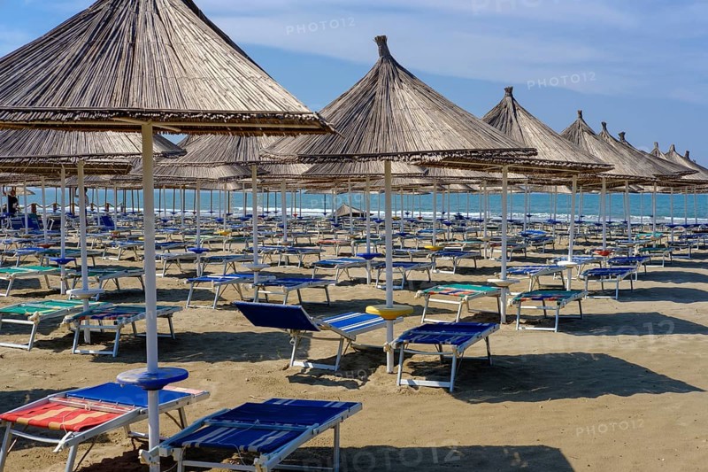 Parasols and sun loungers on the beach in Fushe-Drac near Durres