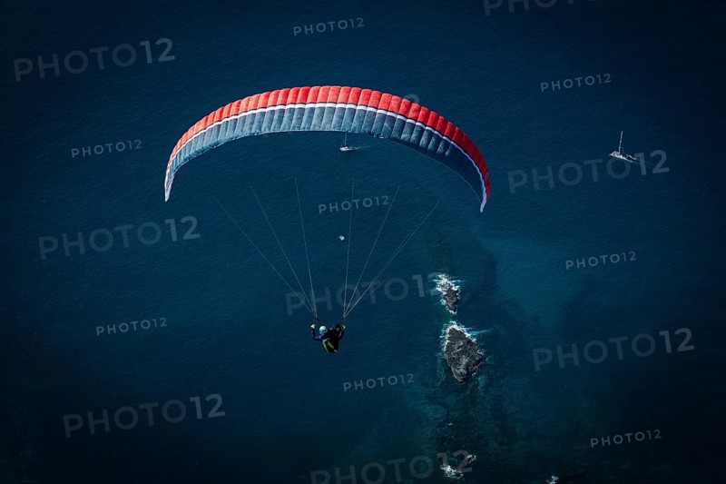 Paraglider over the Atlantic Ocean near La Caleta