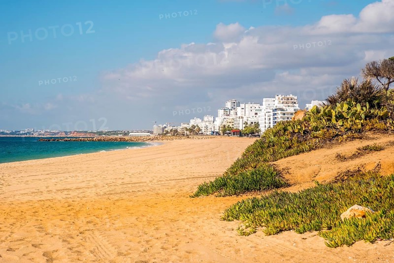 Wide sand beach with apartement resorts