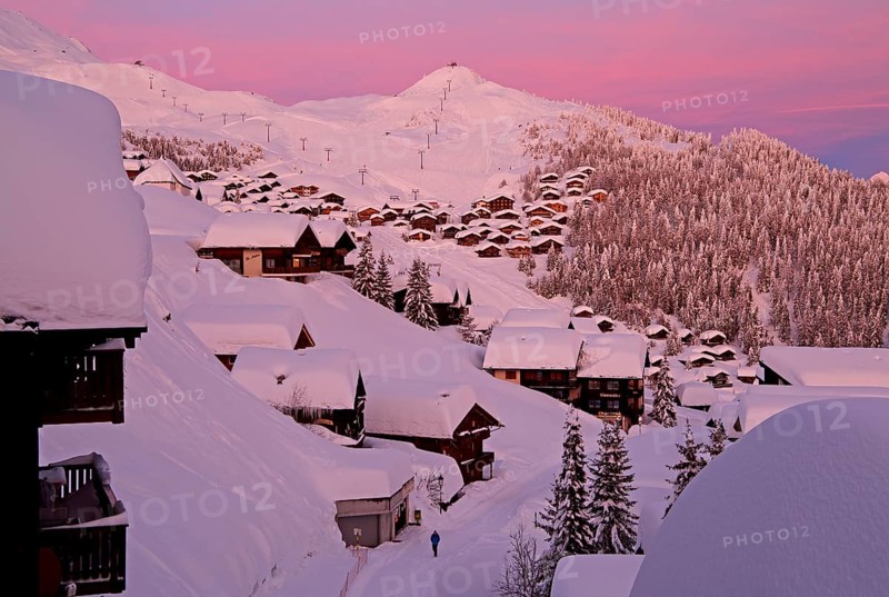 Village view snow-covered at dusk
